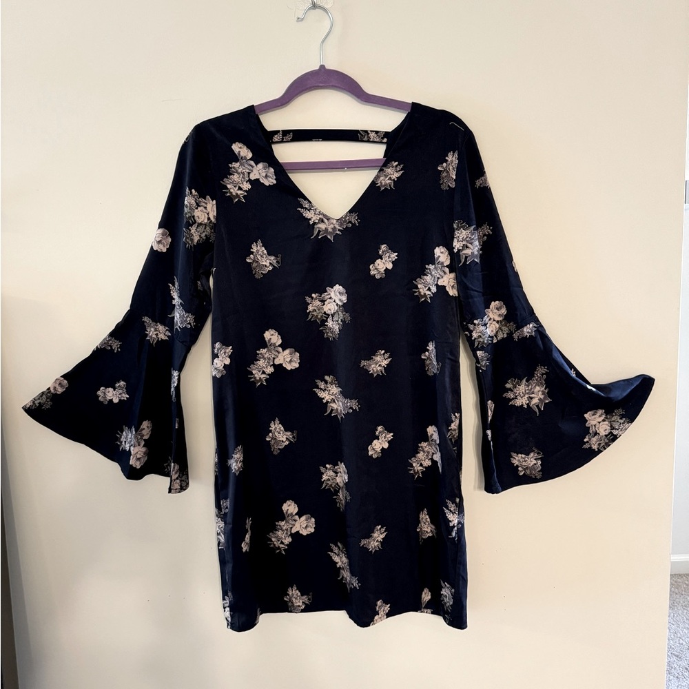 Black floral flare-sleeved dress by Collective Concepts